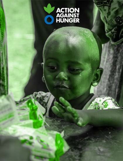 A hungry african child about to pick some food from shelf.