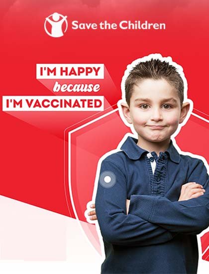 a 7 year old child in blue shirt with red background. "im happy because im vaccinated" written on left.